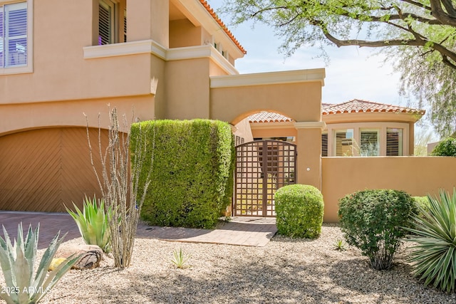 32731 N 74th Way, Scottsdale, AZ 85266 - view of front of home with a gate, a tiled roof, and stucco siding