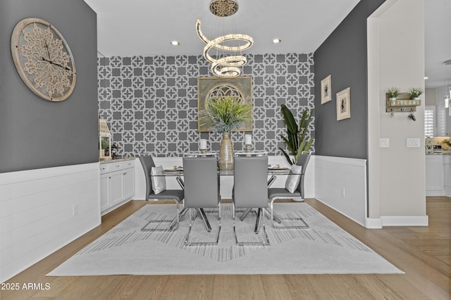 dining area featuring a chandelier and light hardwood / wood-style flooring