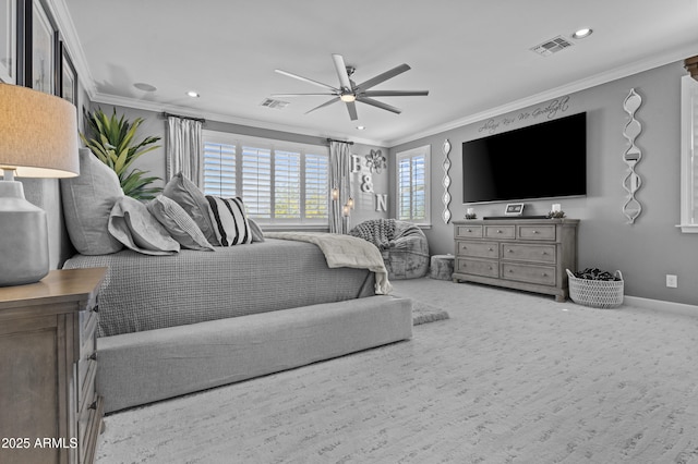 bedroom with crown molding, carpet, and ceiling fan