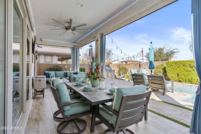 sunroom / solarium with ceiling fan