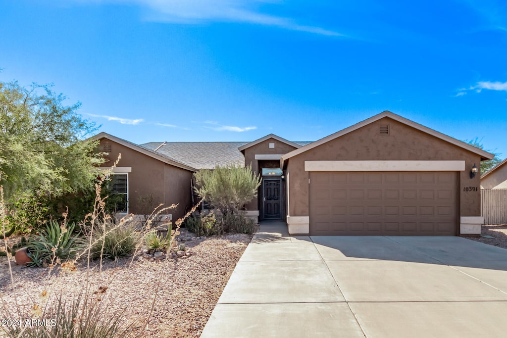 single story home featuring a garage