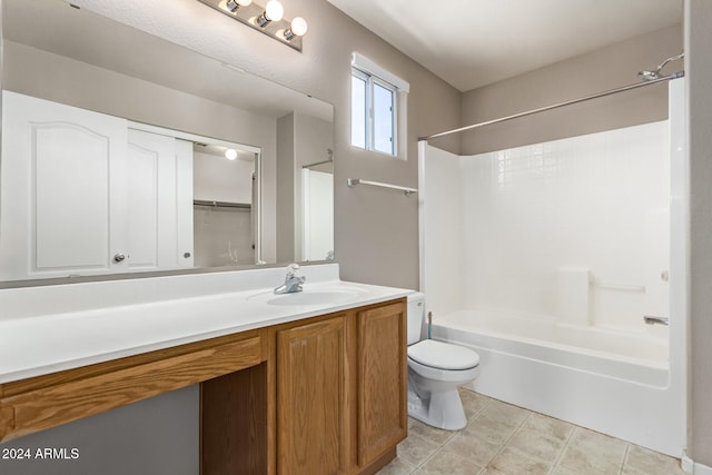 full bathroom featuring tile patterned floors, vanity, toilet, and shower / washtub combination