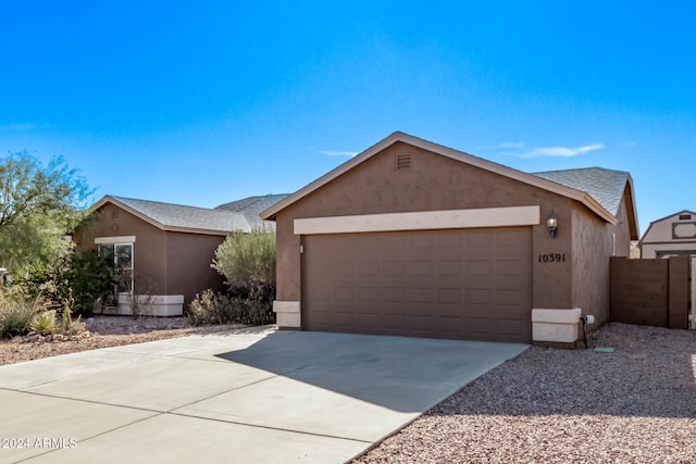 single story home featuring a garage