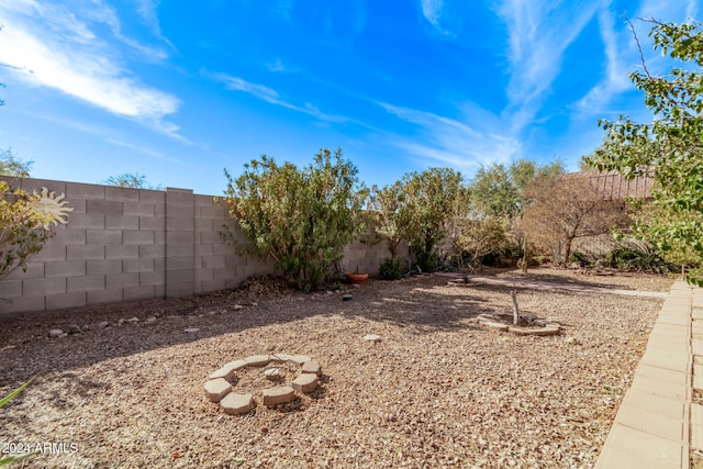 view of yard with an outdoor fire pit