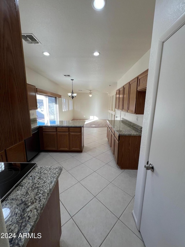 kitchen featuring light tile patterned flooring, black electric cooktop, kitchen peninsula, pendant lighting, and light stone counters