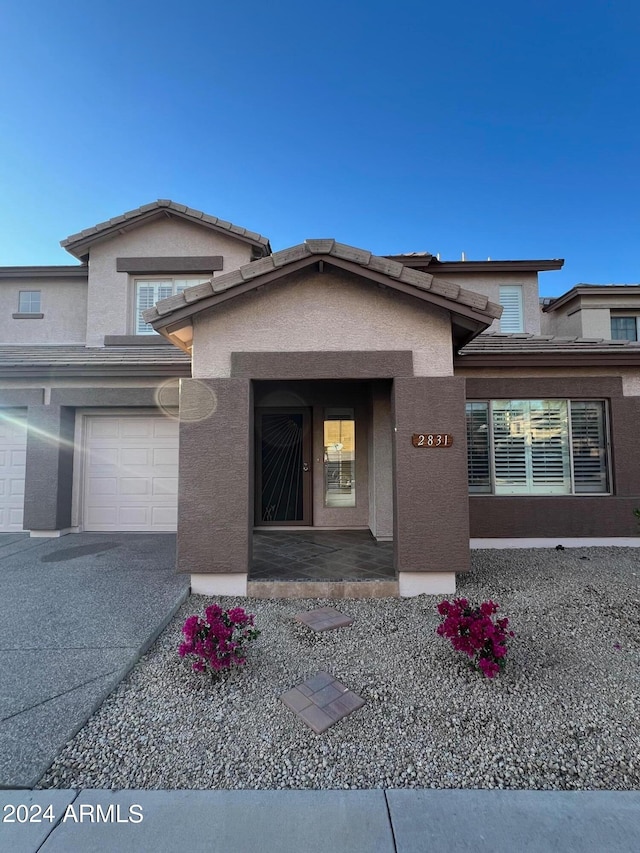 view of exterior entry with a garage