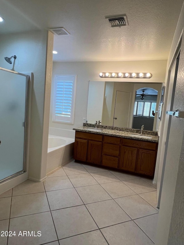 bathroom with vanity, independent shower and bath, tile patterned flooring, and ceiling fan