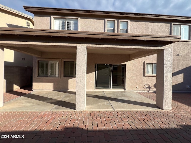 back of house with a patio area