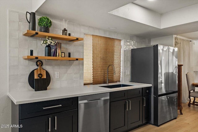 kitchen featuring light hardwood / wood-style floors, sink, and stainless steel appliances