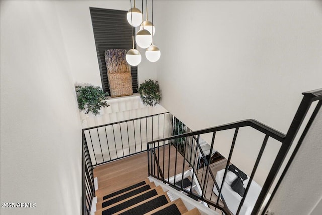 stairway featuring hardwood / wood-style flooring