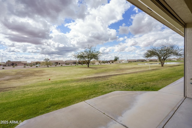 view of yard with a patio and a residential view