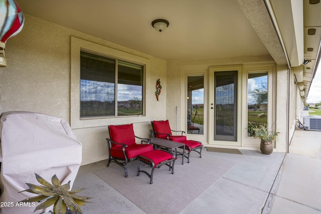 view of patio / terrace featuring area for grilling and cooling unit