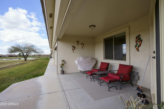 view of patio featuring a grill