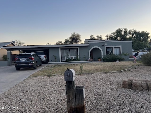 single story home with a carport