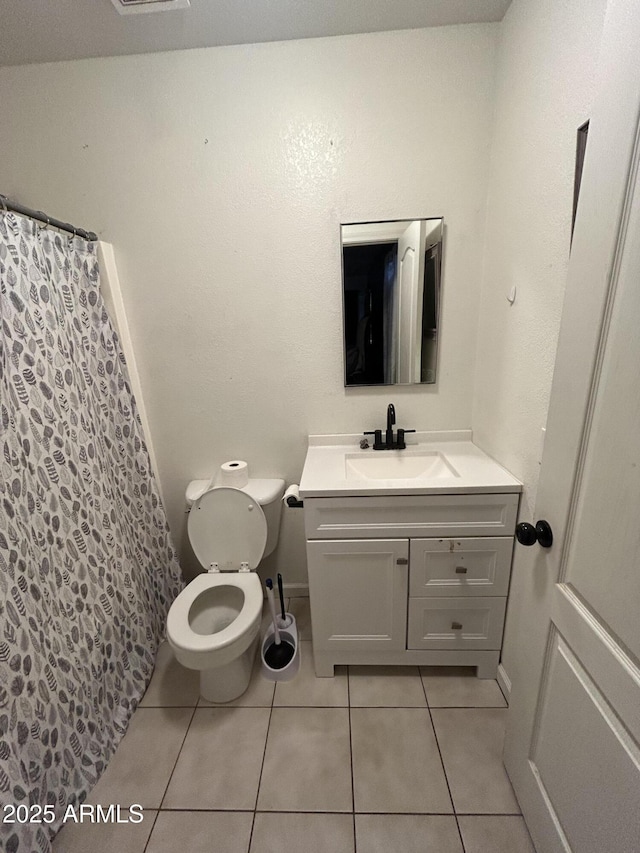 full bathroom with tile patterned flooring, a shower with shower curtain, vanity, and toilet