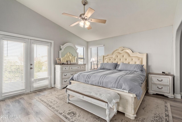 bedroom with access to outside, french doors, lofted ceiling, and light wood finished floors