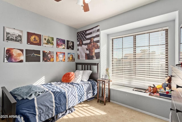 bedroom featuring carpet, baseboards, and ceiling fan