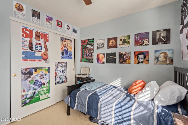 carpeted bedroom with a ceiling fan