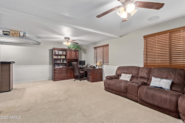 home office with light carpet and ceiling fan