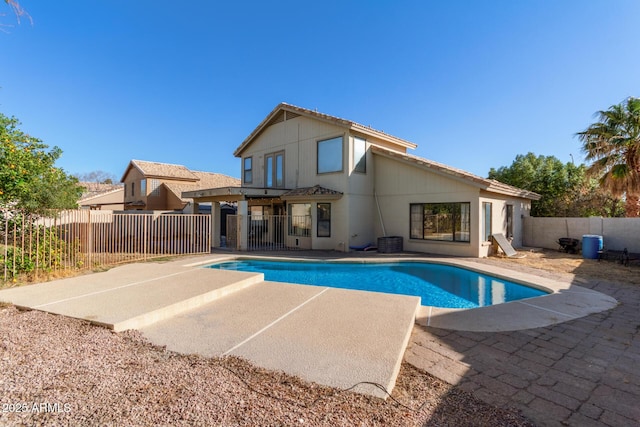 view of pool featuring a fenced in pool, cooling unit, a patio area, and a fenced backyard