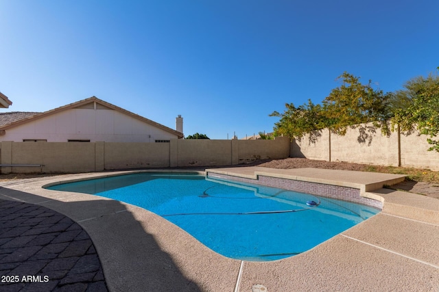 view of swimming pool featuring a fenced backyard and a fenced in pool