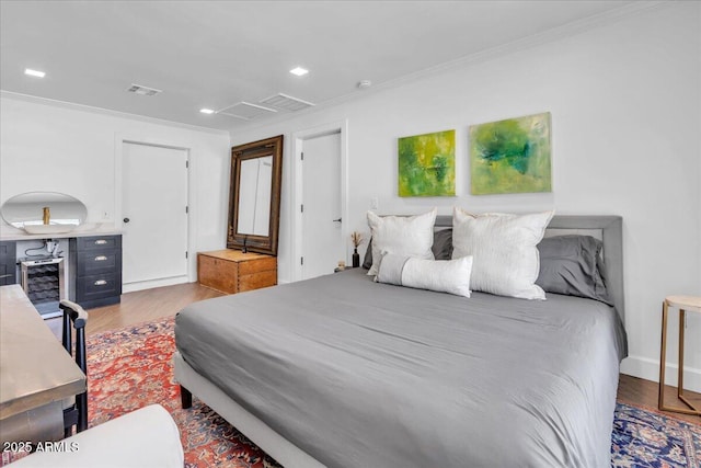 3505 N Miller Rd, Scottsdale, AZ 85251 - bedroom with ornamental molding, wood finished floors, recessed lighting, and baseboards