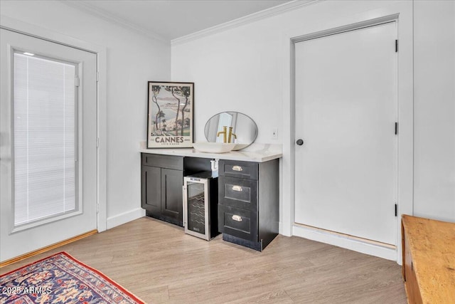 3505 N Miller Rd, Scottsdale, AZ 85251 - bar featuring beverage cooler, light wood finished floors, ornamental molding, and baseboards
