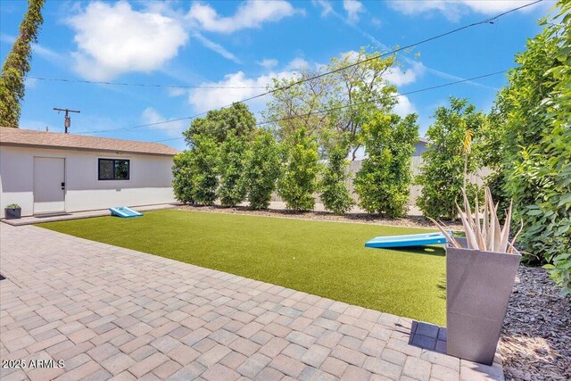 3505 N Miller Rd, Scottsdale, AZ 85251 - view of grassy yard with a patio area