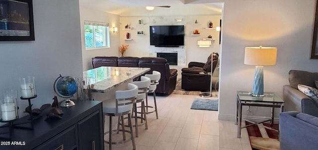 4617 E Emile Zola Ave, Phoenix, AZ 85032 - living room with ceiling fan and a fireplace
