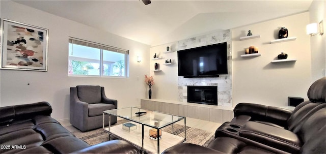 4617 E Emile Zola Ave, Phoenix, AZ 85032 - living room featuring vaulted ceiling, a fireplace, and wood finished floors