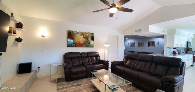 4617 E Emile Zola Ave, Phoenix, AZ 85032 - living room with ceiling fan, vaulted ceiling, and light tile patterned flooring