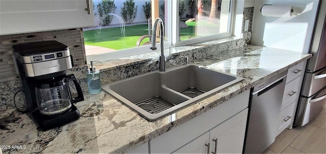 4617 E Emile Zola Ave, Phoenix, AZ 85032 - kitchen featuring dishwasher, white cabinetry, and light stone countertops