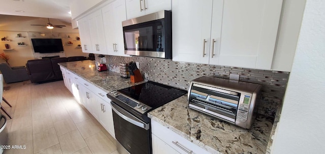 4617 E Emile Zola Ave, Phoenix, AZ 85032 - kitchen featuring stainless steel appliances, a ceiling fan, backsplash, open floor plan, and light stone counters