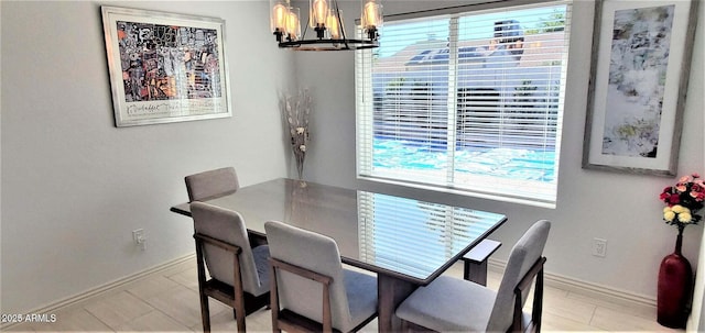 4617 E Emile Zola Ave, Phoenix, AZ 85032 - dining area with a chandelier and light tile patterned floors