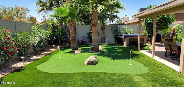 4617 E Emile Zola Ave, Phoenix, AZ 85032 - fenced backyard featuring an area to practice putting, a hot tub, and a patio