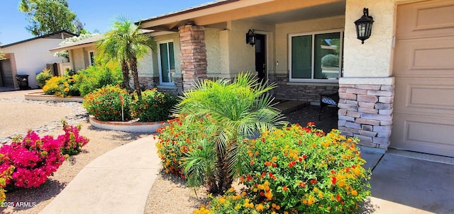 4617 E Emile Zola Ave, Phoenix, AZ 85032 - entrance to property with stone siding, stucco siding, and a garage