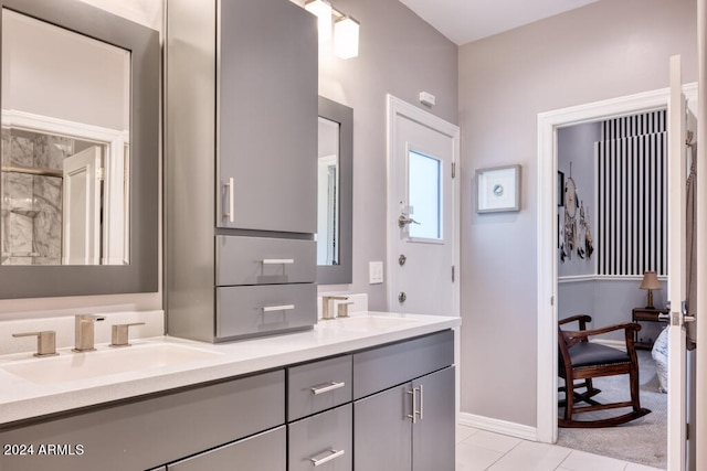 bathroom with tile patterned flooring and vanity