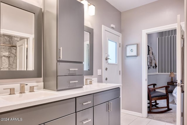 7101 E Berneil Ln, Paradise Valley, AZ 85253 - full bath featuring double vanity, tile patterned floors, baseboards, and a shower