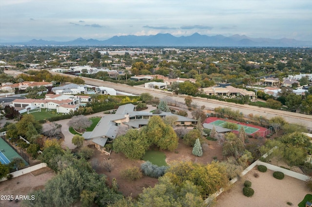 birds eye view of property with a mountain view