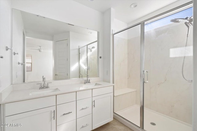 bathroom with vanity, tile patterned floors, ceiling fan, and walk in shower