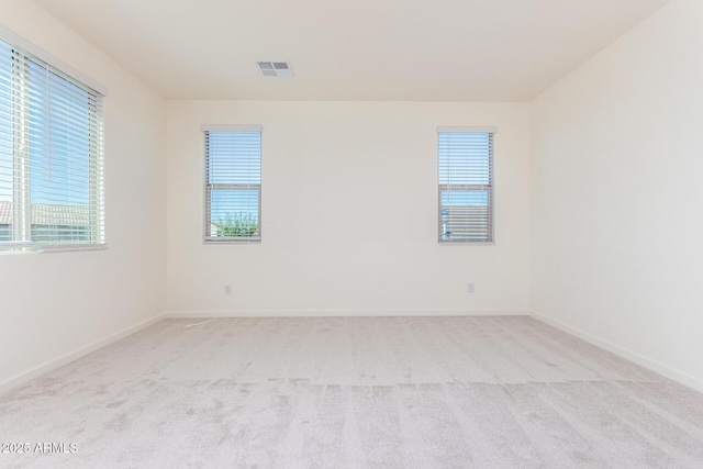 unfurnished room with light carpet