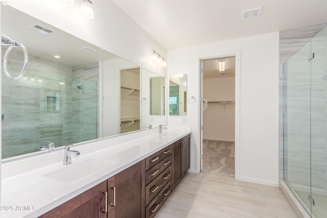 bathroom with vanity and walk in shower