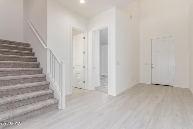 staircase featuring hardwood / wood-style floors