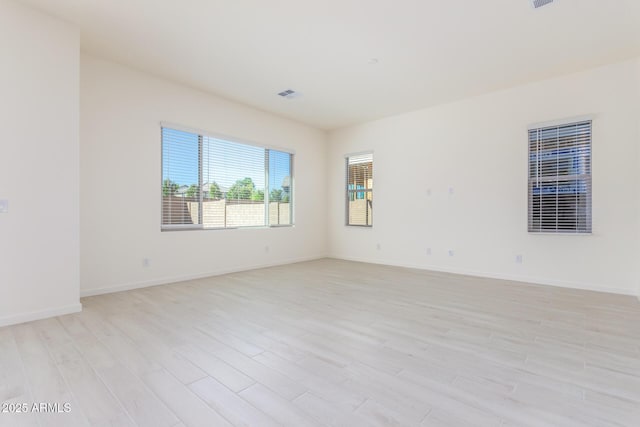 unfurnished room featuring light wood-type flooring