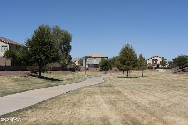 view of home's community with a yard