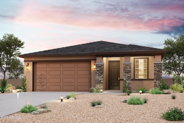 17764 W Fulton St, Goodyear, AZ 85338 - prairie-style home with concrete driveway, an attached garage, stone siding, and stucco siding