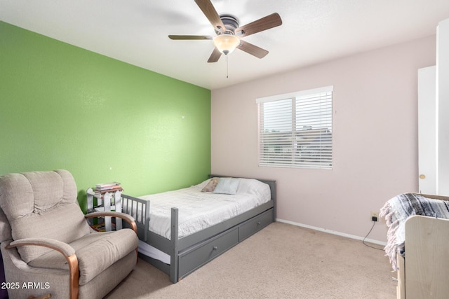 bedroom featuring light carpet, ceiling fan, and baseboards