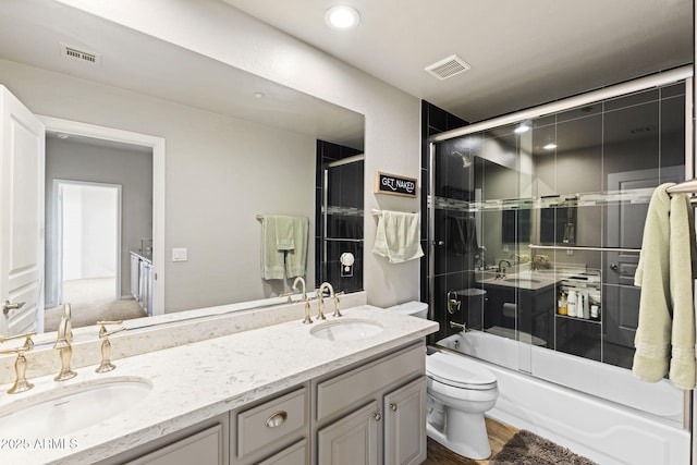 bathroom with visible vents, a sink, and toilet