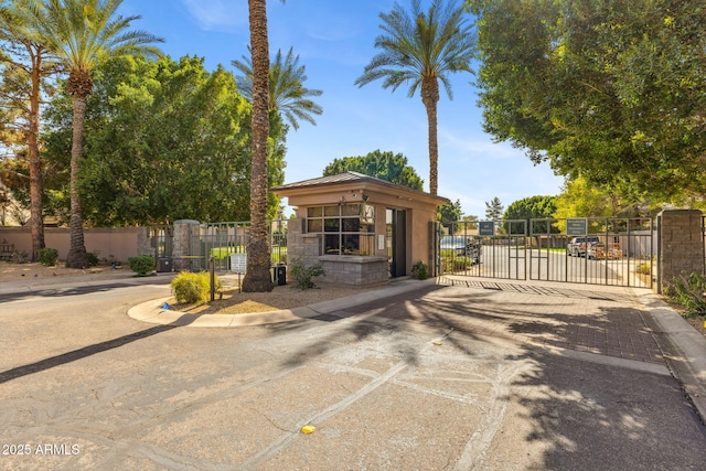 view of front of property featuring a gate and fence