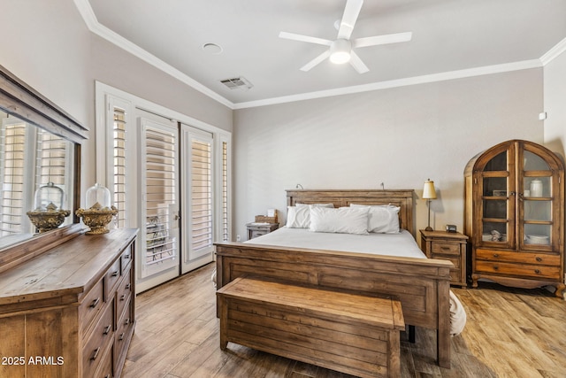 bedroom featuring access to outside, visible vents, light wood-style flooring, and crown molding